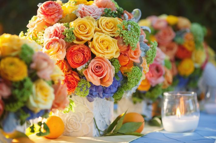 bright summer wedding flower centerpiece citrus hues with roses