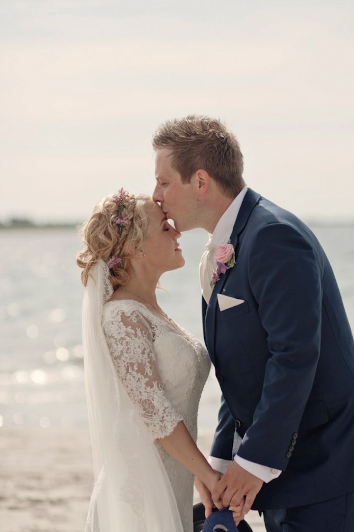 Beach real wedding kiss