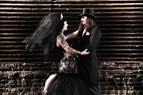 bride and groom in costume goth vamp wedding theme