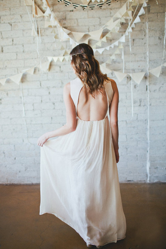Simple draped wedding dress with open back