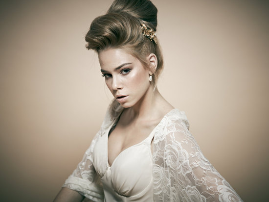 Silky bridal updo high bun with pouf