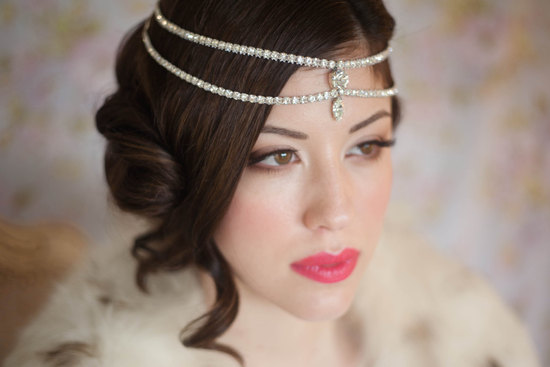 Silky wedding updo with tendrils crystal bridal headdress