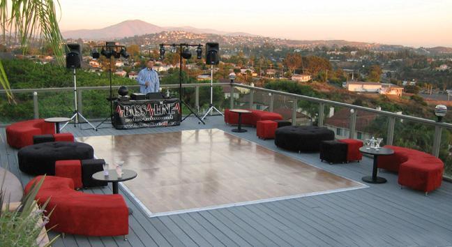 Adding-furniture-to-wedding-reception-outdoor-modern-wedding-on-deck-red-black-lounge-chairs-end-tables.full