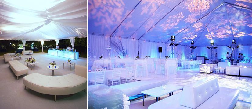 Adding-furniture-to-wedding-reception-modern-white-tables-chairs-couches-blue-purple-illuminating-lights.full
