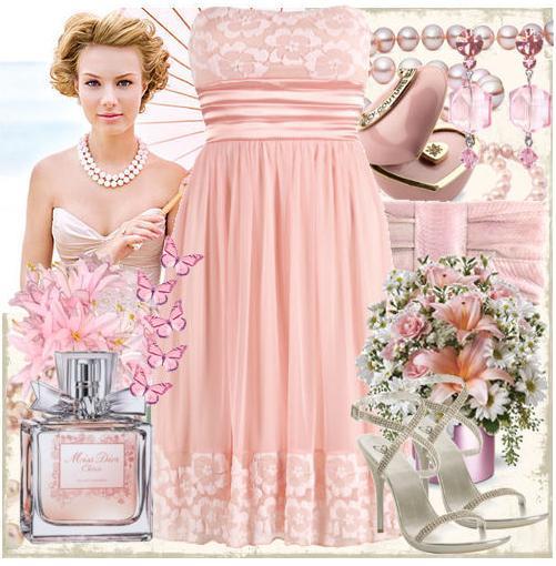photo of Light pink, flowers, and butterflies bring a whimsical feel to any wedding