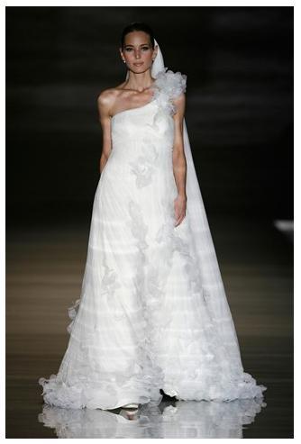 Beautiful white wedding dress, asymmetrical with floral details, full skirt