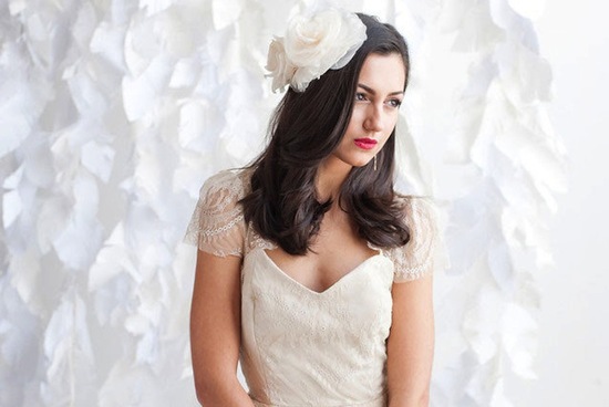All down wedding hair with large ivory flowers