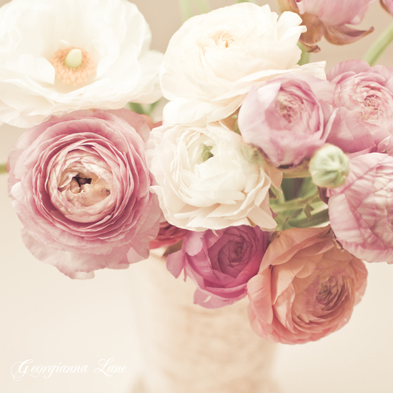 Romantic wedding centerpiece of ranunculus and david austin roses