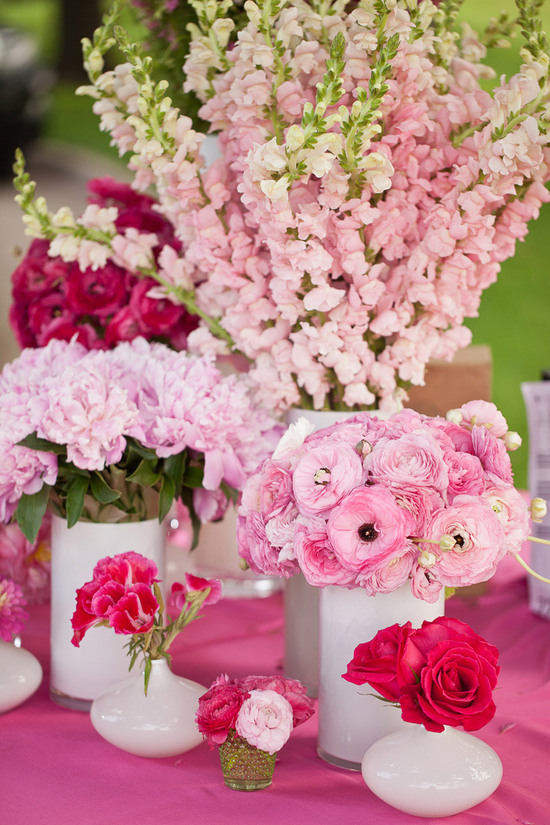 Assorted pink wedding centerpieces reception tablescape