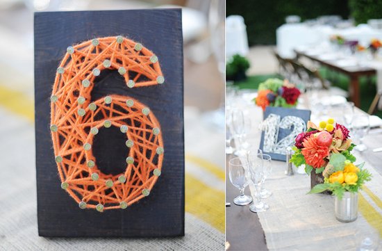 photo of yarn table numbers wedding reception