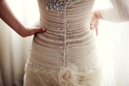 Amazing corseted wedding dress with beading up the back