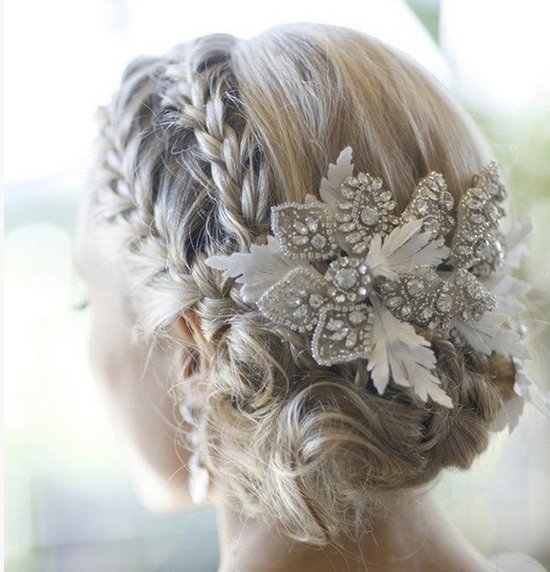 Double braid wedding hairstyle finished with a beaded fascinator