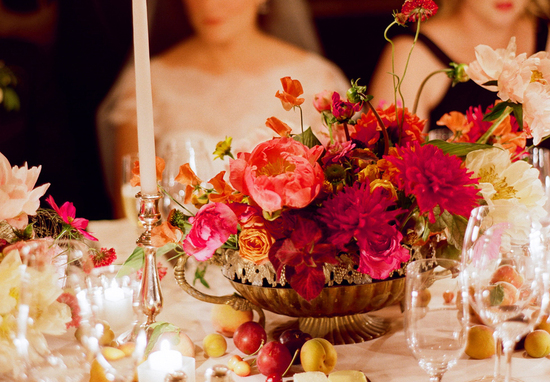 Romantic wedding reception tablescape with red peony centerpiece