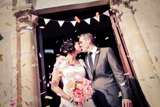 Bride and groom kiss after saying I Do