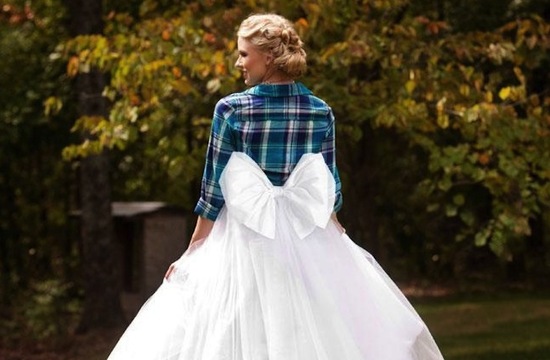 braided wedding chignon on bride wearing plaid