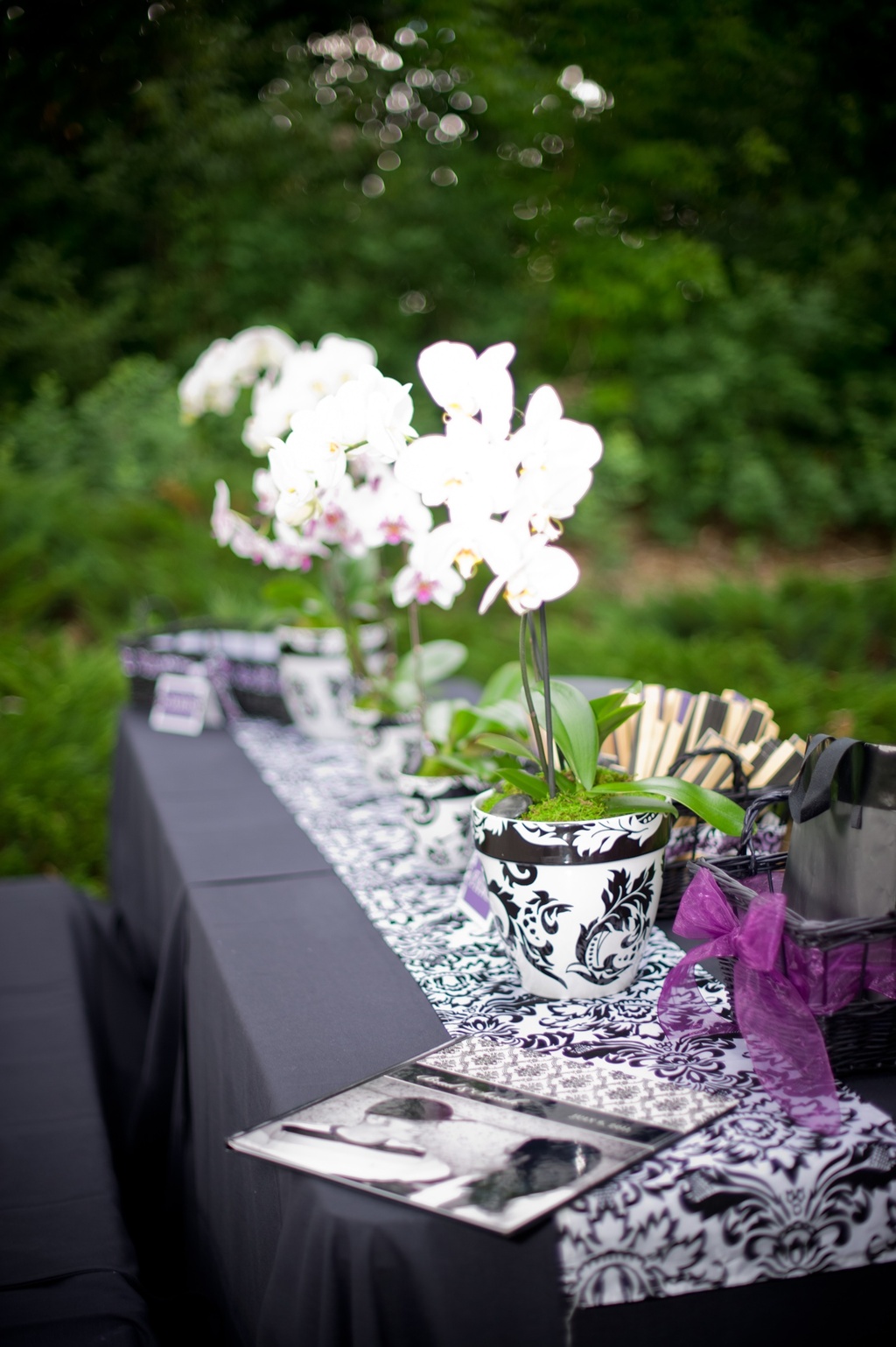 Outdoor-wedding-reception-black-white-damask-purple-wedding-flowers.full