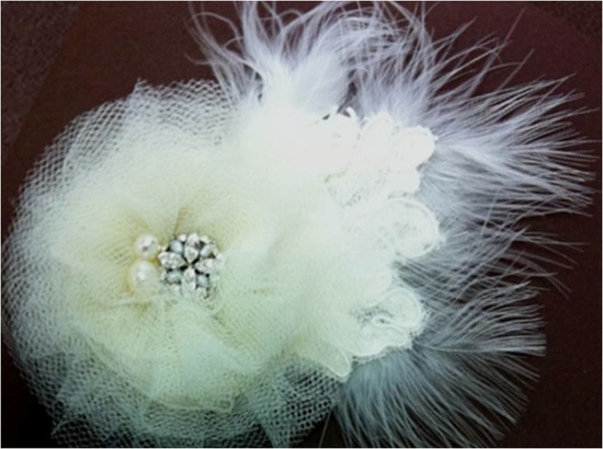 Bridal fascinator embellished with vintage brooch and feathers