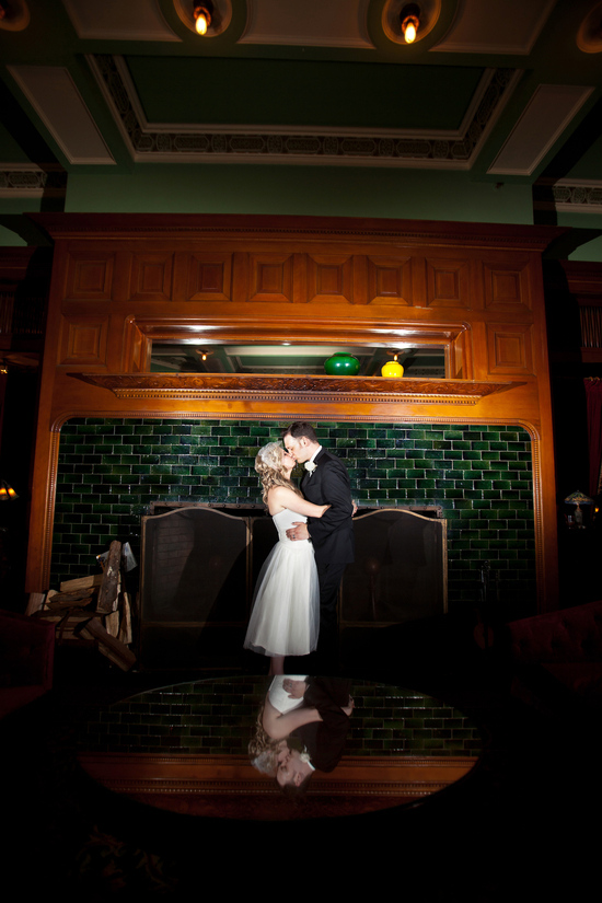 Bride and groom share an intimate kiss during the reception