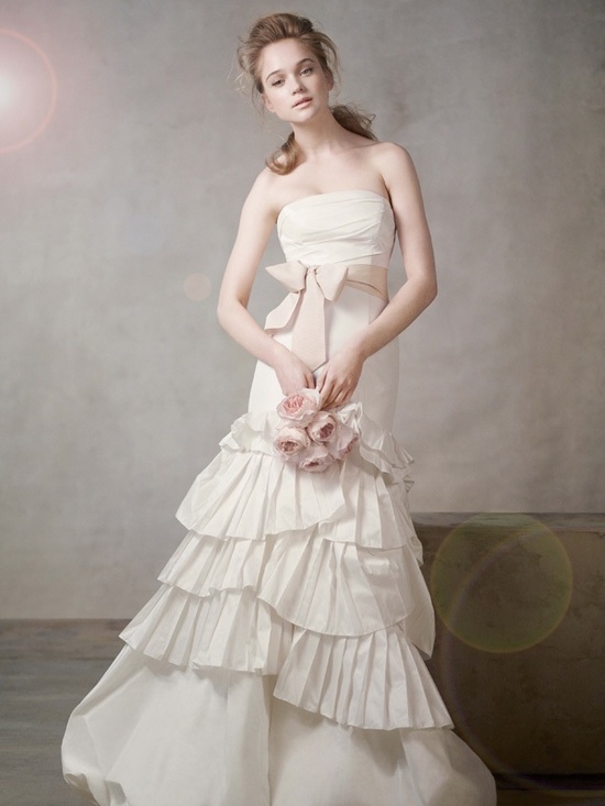 Ivory strapless mermaid wedding dress with blush pink sash by Vera Wang