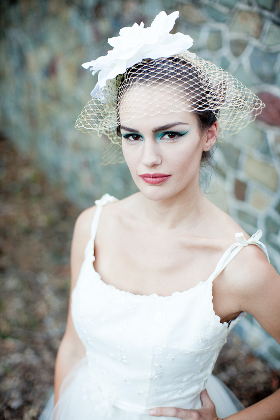 Dramatic bridal makeup and vintage birdcage veil