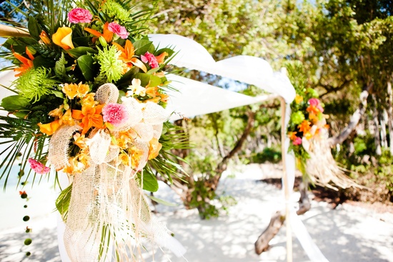 Tropical wedding reception decor with a beach theme and unique table centerpieces