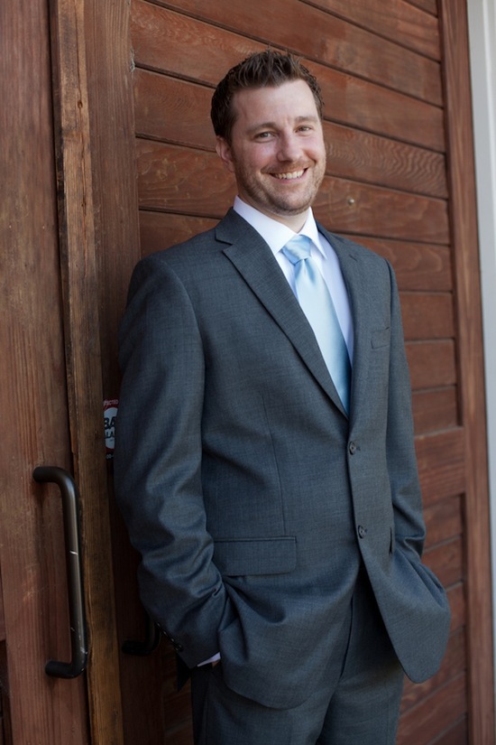 Groom in dark grey and blue Tuxedo and Suit