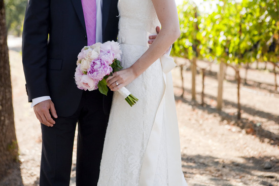Outdoor Napa, California wedding- bride wears ivory lace wedding dress ,groom, is casual in black su