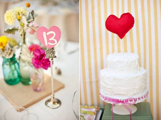 Adorable white wedding cake with red heart cake topper