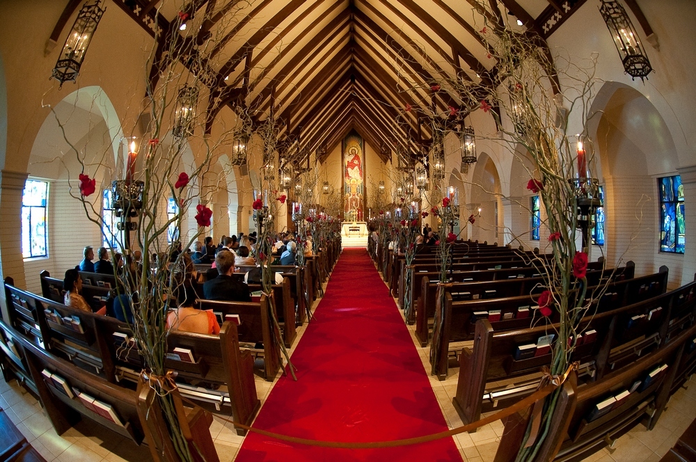Regal-ornate-wedding-ceremony-venue-stain-glass-windows-in-church-red-carpet-aisle.full