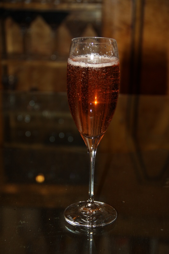 photo of This red cocktail in a champagne flute would be perfect for any red themed party.