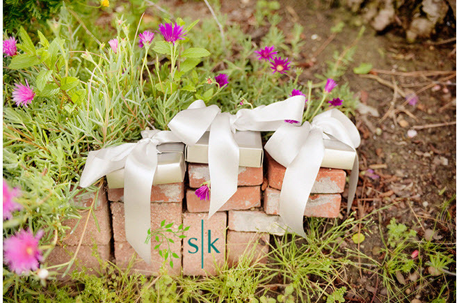 Wedding-detail-shot-wedding-gifts-for-guests-tied-with-white-ribbon-orange-county-california-wedding.full
