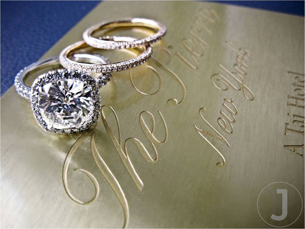 Luxurious-champagne-ivory-gilded-letterpress-wedding-invitations-with-diamond-engagement-ring-wedding-band-on-top.full