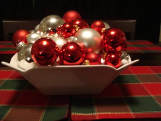 These red, white, and silver ornaments create a Christmas themed centerpiece perfect for a holiday w
