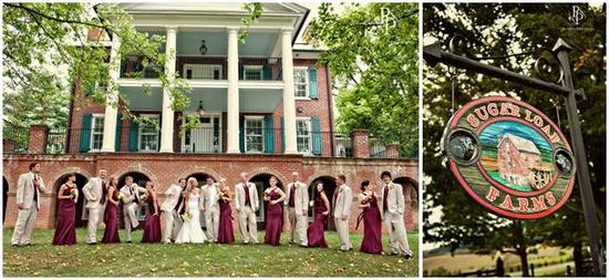 Bridesmaids in maroon bridesmaids' dresses, groomsmen in khaki suits, pose together in front of plan