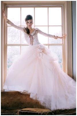 Light-powder-pink-tulle-full-skirt-wedding-dress-dusty-rose-bow-long-sleeves.full