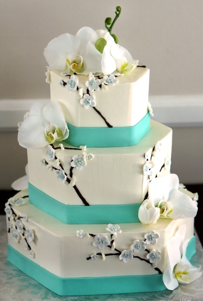 Tropical-wedding-cake-white-three-tier-aqua-ribbon-white-orchids.full