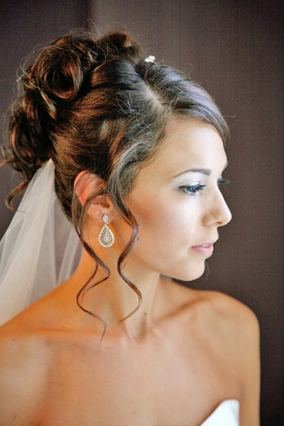Bridal-hairstyle-all-up-side-part-curls-with-tendrils-framing-brides-face-drop-earrings.full
