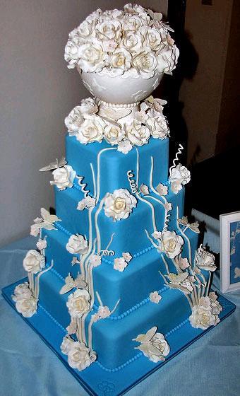 Blue-wedding-cake-adorned-with-white-flowers.full