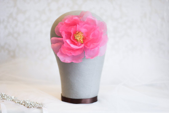 photo of Rich pink wedding hair flower