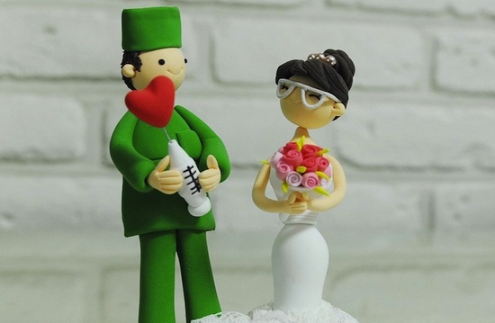 photo of Groom Doc with love syringe wedding cake topper