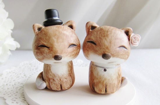 photo of Cute Fox bride and groom wedding cake topper