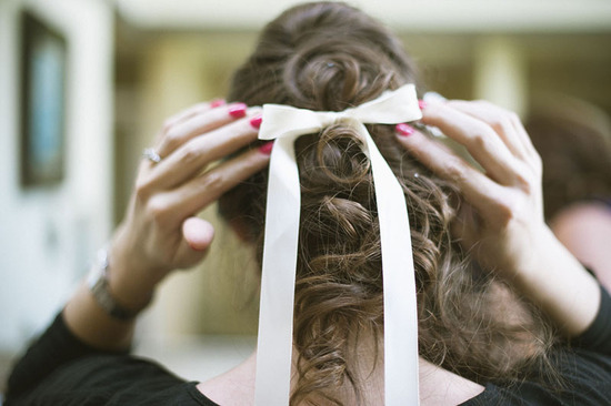 photo of curled ponytail retro wedding hairstyle