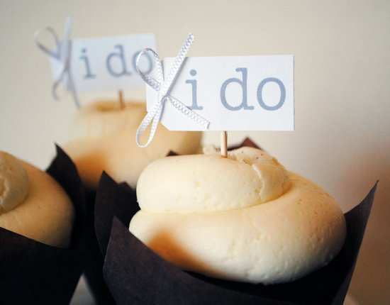 photo of Bow-adorned I Do wedding cupcake flags