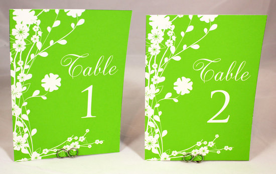 photo of Neon green wedding reception table numbers