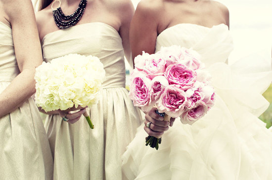 photo of Monochromatic wedding flower bouquets for the bride and her maids