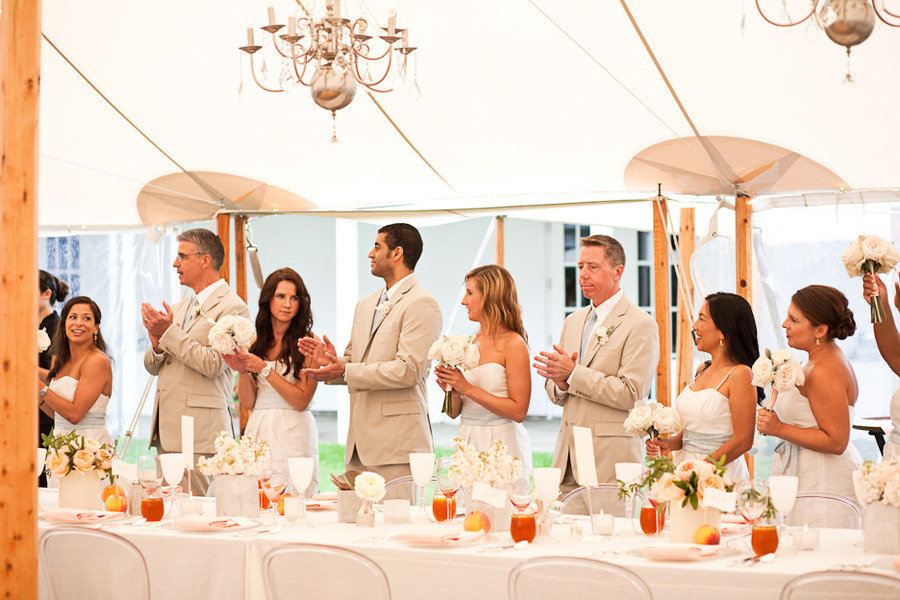 Elegant-real-wedding-outdoor-reception-under-tent-chandeliers-above.full