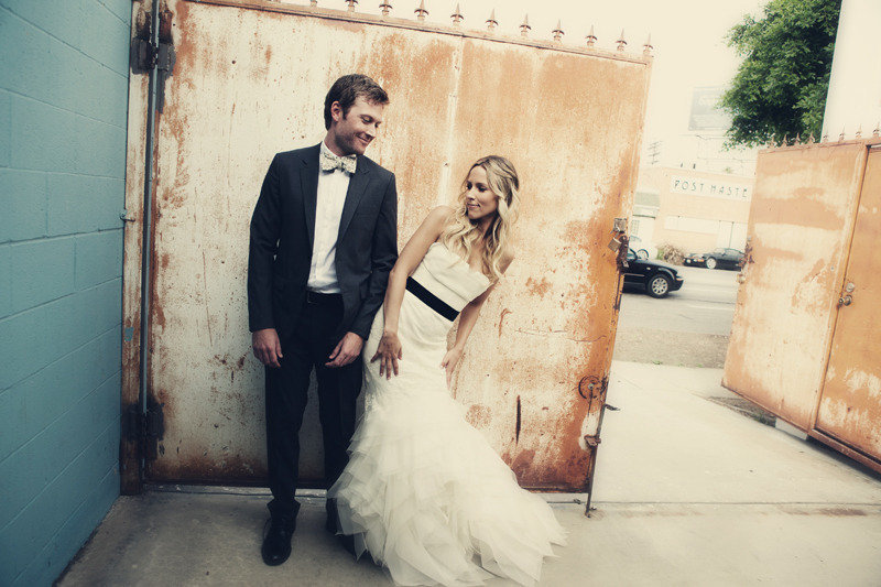 Bride-and-groom-pose-together-outside-la-wedding-venue.full
