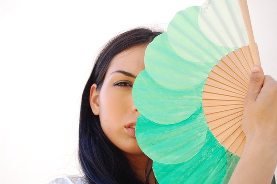photo of Hand-painted mint green fans for outdoor wedding ceremonies