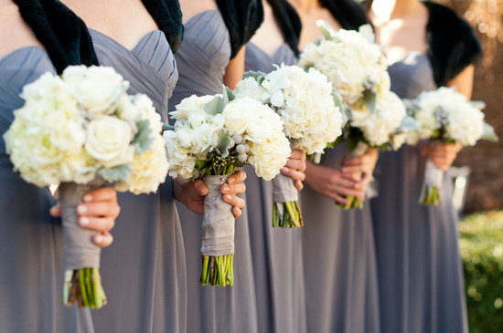 photo of bridesmaids wear grey dresses black shrugs ivory wedding flowers bouquets