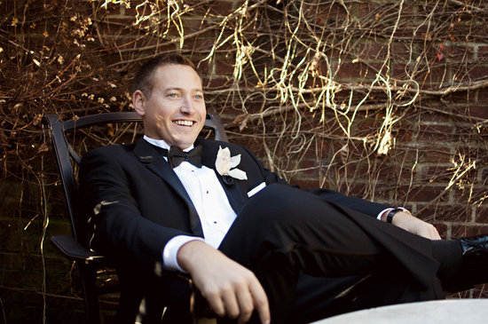 photo of Handsome grooms wearing tuxes and suits, elegant boutonnieres